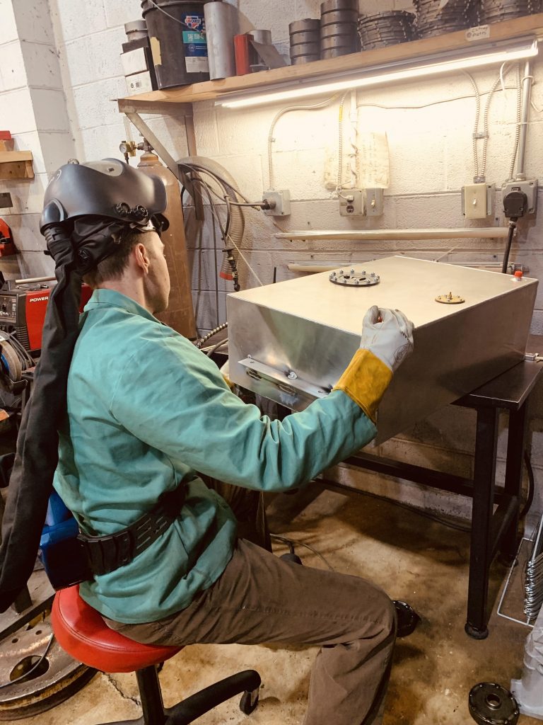 man welding fuel cell